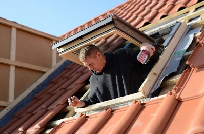 Pose de fenêtres de toit Velux à Bus